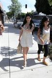 Kim Kardashian shows cleavage in light summer dress shopping at Intermix boutique on Robertson Blvd in Los Angeles