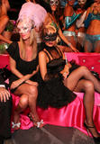 Paris Hilton in black dress showign her legs in black fishnet stockings at Paris Hilton's My New BFF Masquerade Ball at Kress in Hollywood
